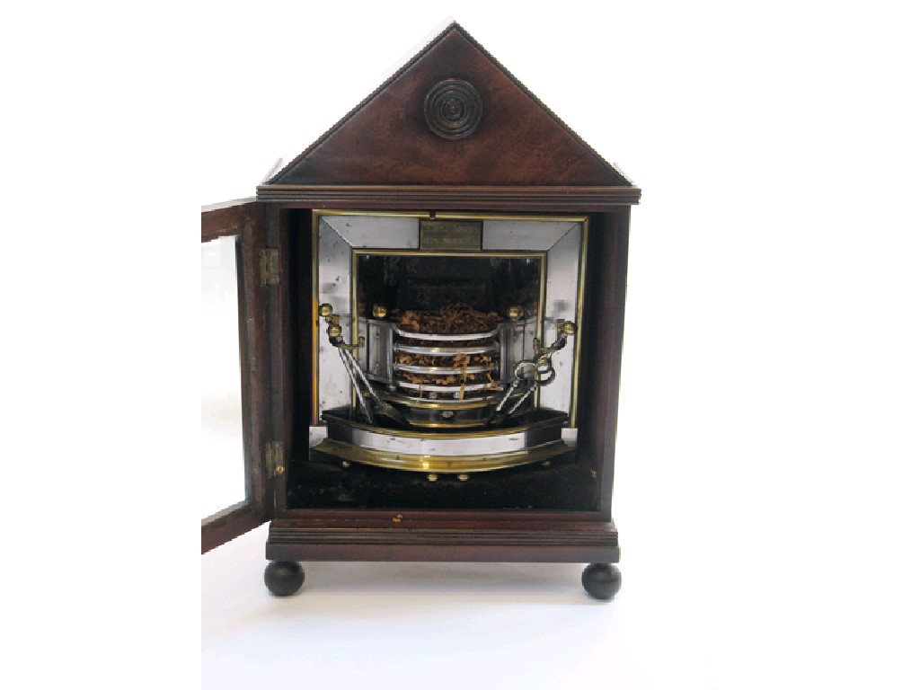 Appraisal: A MINIATURE REGENCY POLISHED STEEL AND BRASS FIREPLACE bearing a