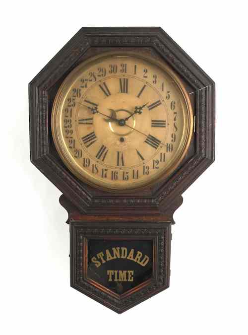 Appraisal: Gilbert walnut standard time regulator clock early th c h