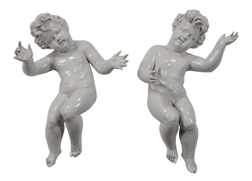 Appraisal: Pair Porcelain Putti Continental th century white glazed each about