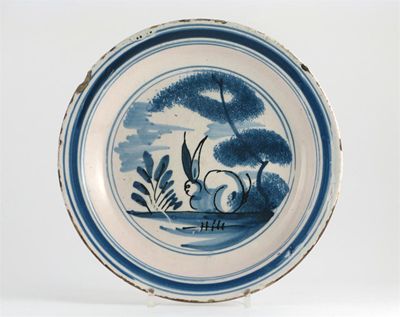 Appraisal: A Delftware blue and white dish probably London painted with