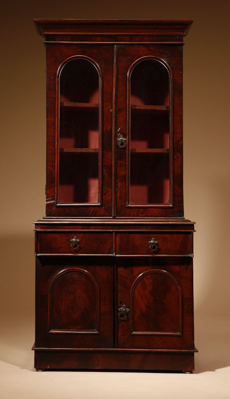 Appraisal: A Victorian mahogany diminutive bookcase cabinet A Victorian mahogany diminutive