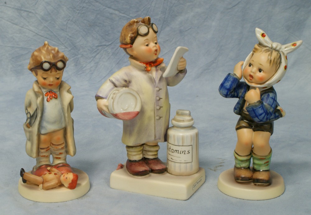 Appraisal: Goebel Hummel Figurines Little Pharmacist some crazing No TMK- Boy