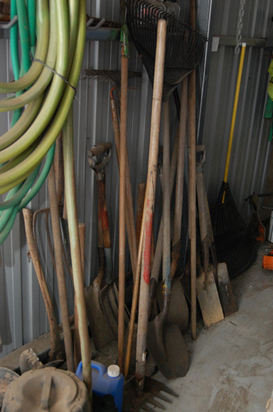 Appraisal: A LARGE COLLECTION OF GARDENING TOOLS INCLUDING SHOVELS AXES AND