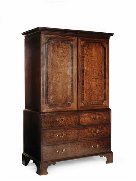 Appraisal: A George III mahogany linen press key pattern blind fretwork