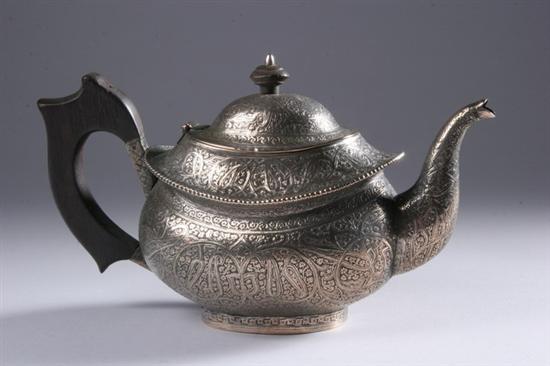 Appraisal: ANGLO-INDIAN SILVER TEA POT Circa Chased to depict scrolling foliage