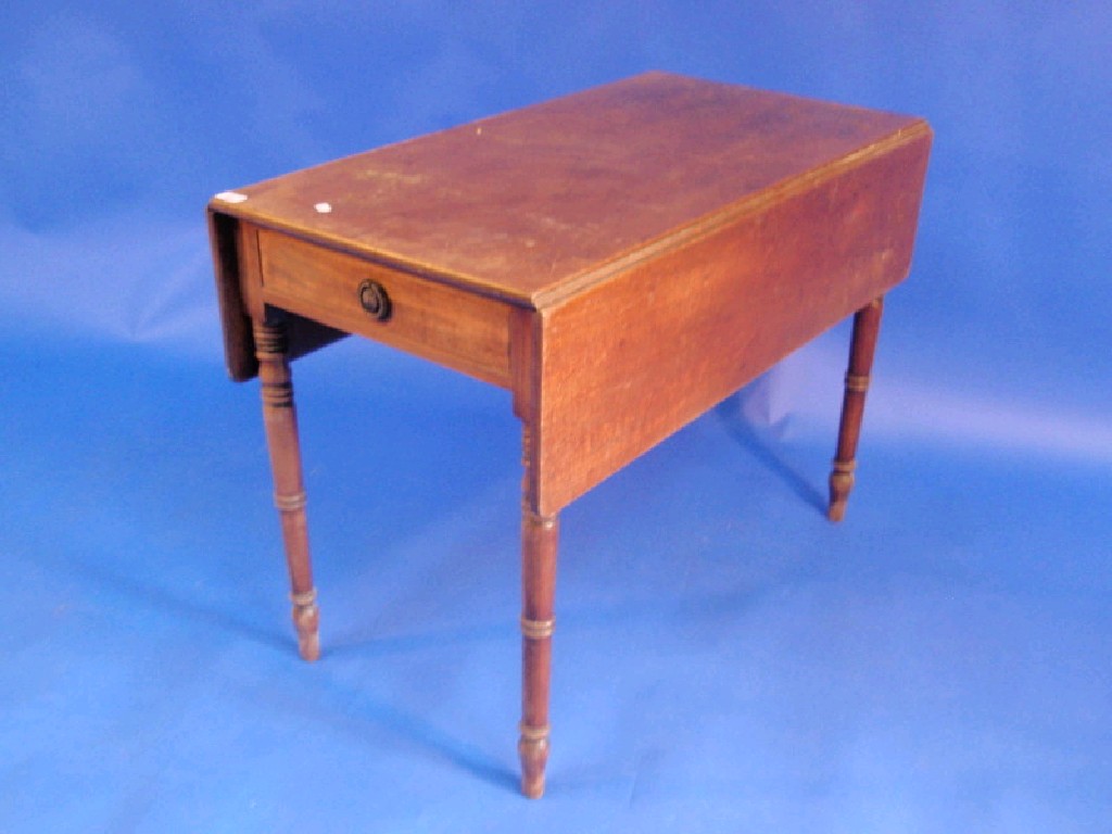 Appraisal: A Regency mahogany Pembroke table with drawer and ring turned