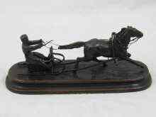 Appraisal: A Russian bronze model of a horse drawn sleigh incised