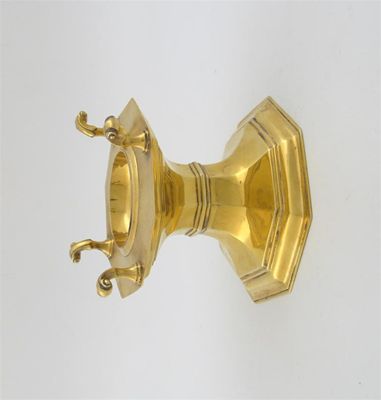 Appraisal: A modern silvergilt octagonal spool salt with four scroll supports