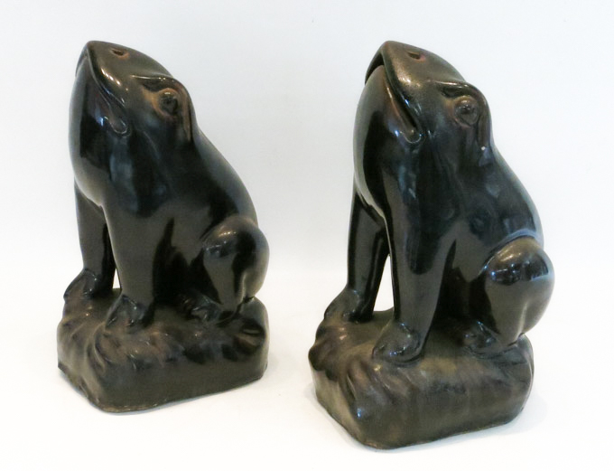 Appraisal: TWO ASIAN INSPIRED POTTERY FROGS in a seated pose with