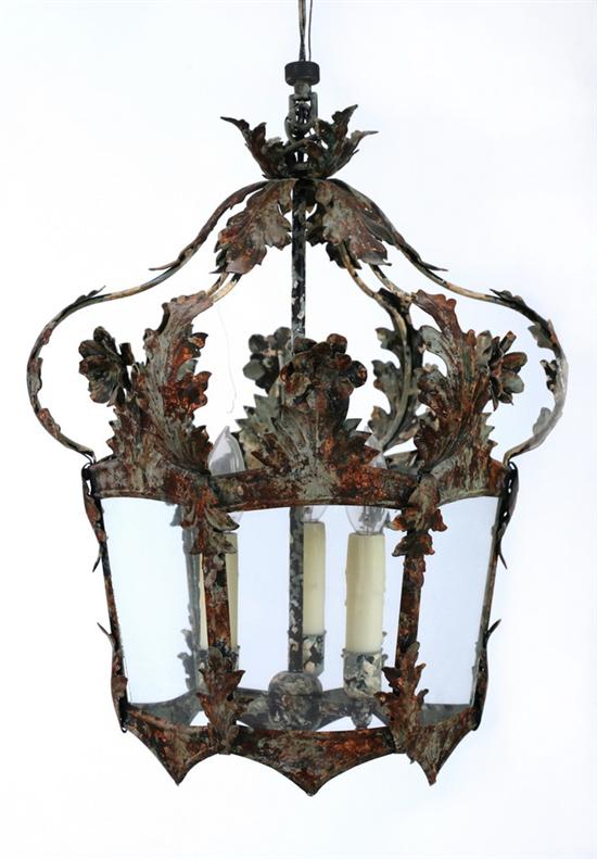 Appraisal: CONTINENTAL PATINATED TOLE THREE-LIGHT HEXAGONAL HANGING LANTERN th century Acanthus