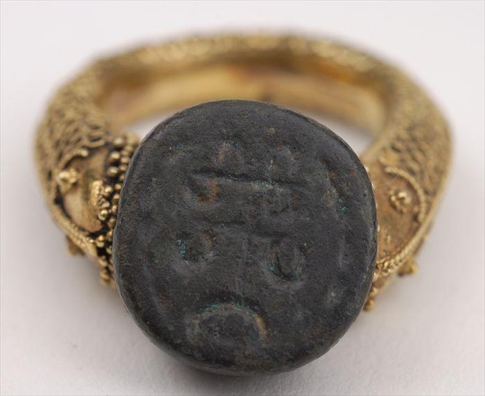 Appraisal: PERSIAN-STYLE SWIVEL RING Approx size Provenance Property from the Collection