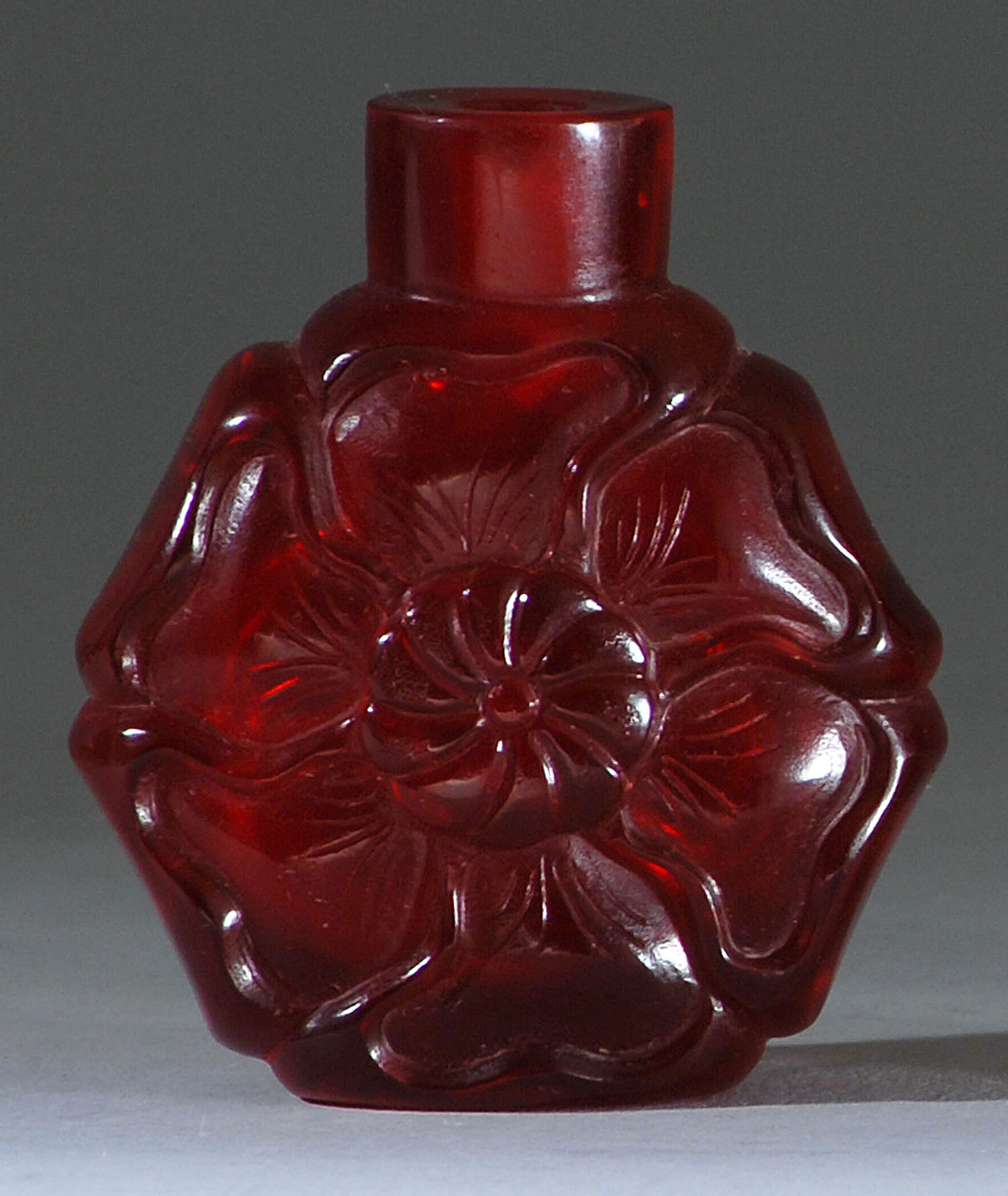 Appraisal: RUBY GLASS SNUFF BOTTLE Late th CenturyIn mallow flower form