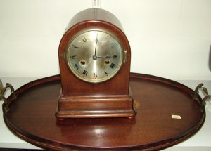 Appraisal: A mahogany cased mantel clock the eight day movement striking