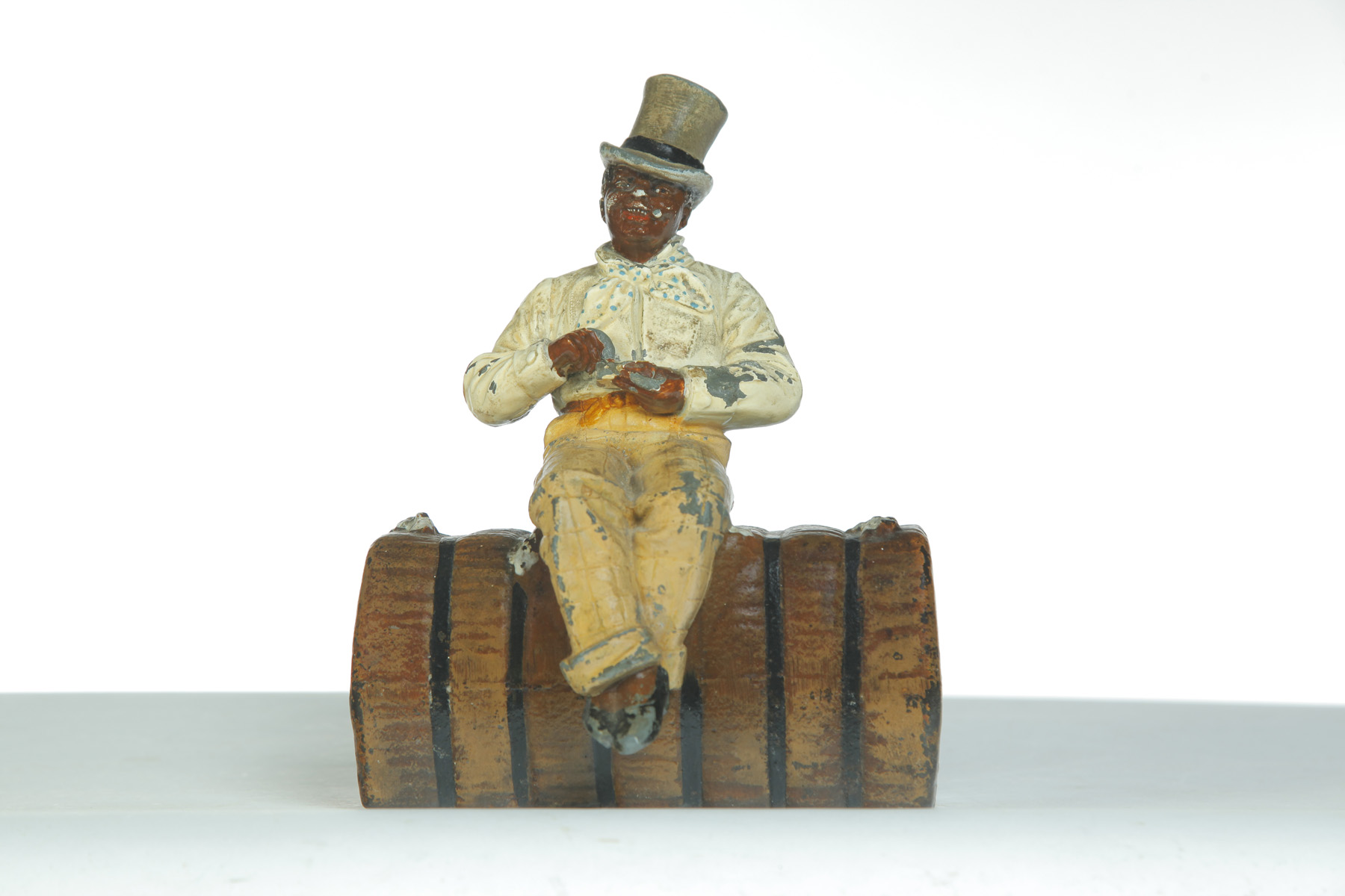 Appraisal: CAST IRON DOORSTOP OF AN AFRICAN AMERICAN MAN ON COTTON