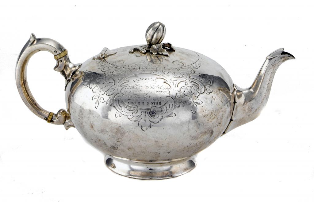 Appraisal: A VICTORIAN TEAPOT with melon knop and engraved with scrolling