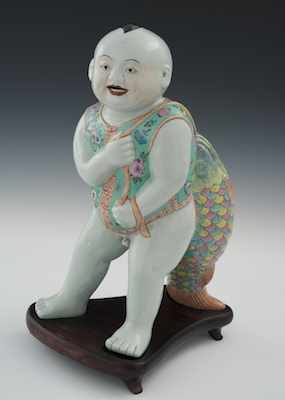 Appraisal: A Large Porcelain Figure of Baby Boy in DouDu Vest