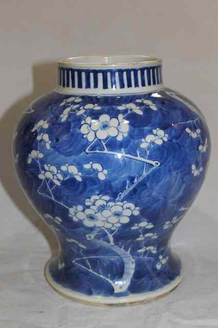 Appraisal: A BLUE AND WHITE PORCELAIN BALUSTER VASE decorated with prunus