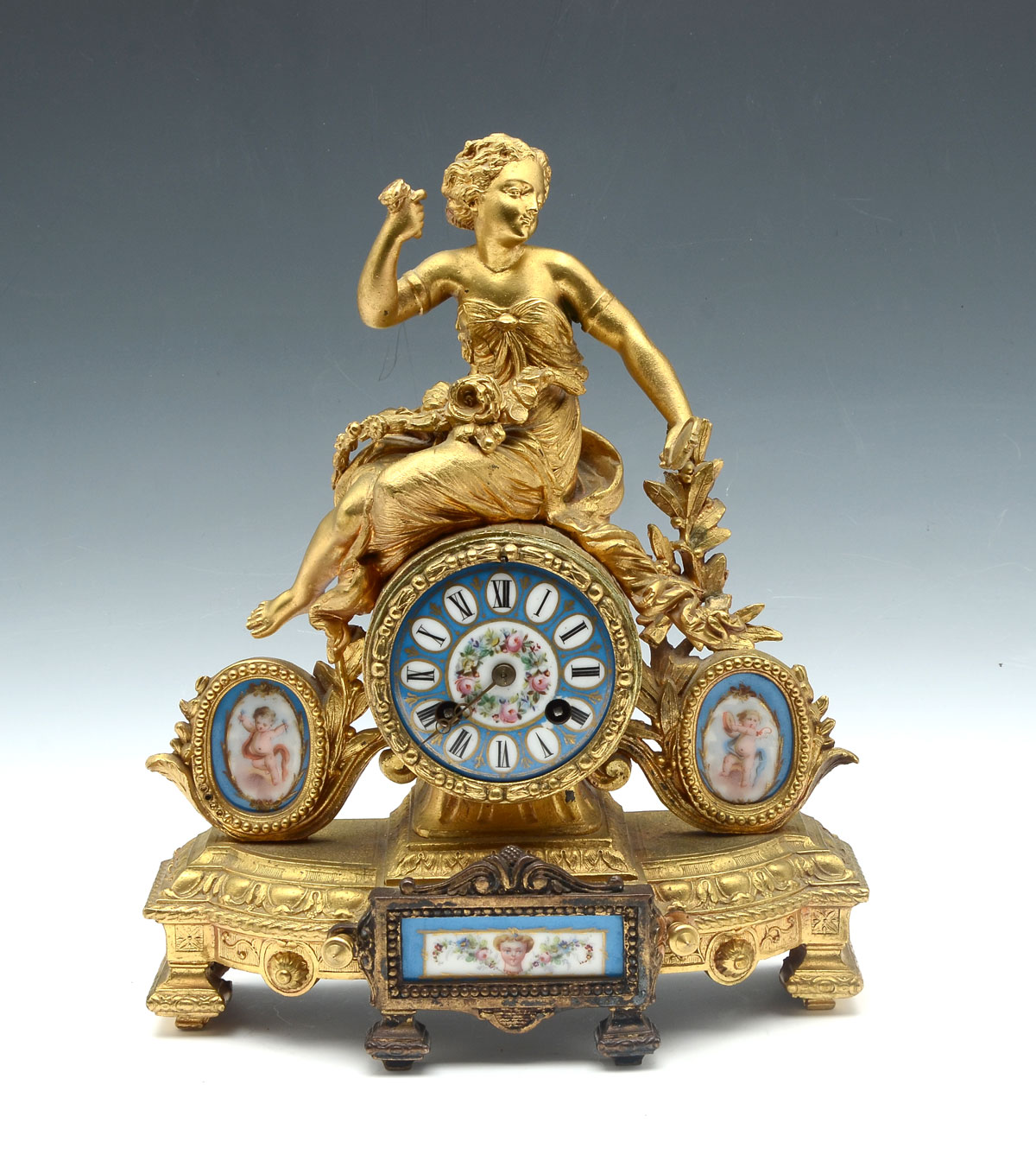 Appraisal: GILT SEVRES FIGURAL CLOCK Gilt French clock with a surmounting