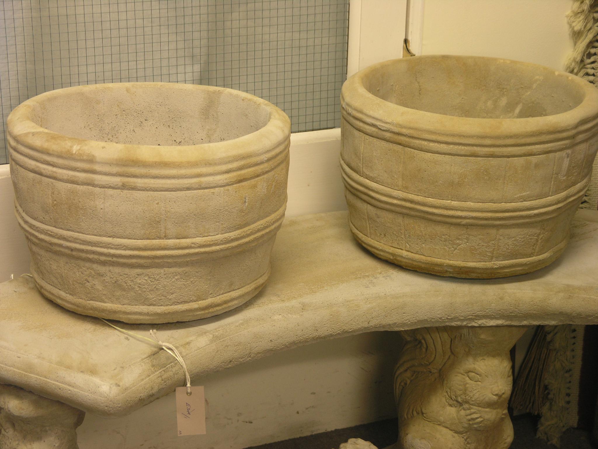 Appraisal: A pair of moulded garden barrel planters