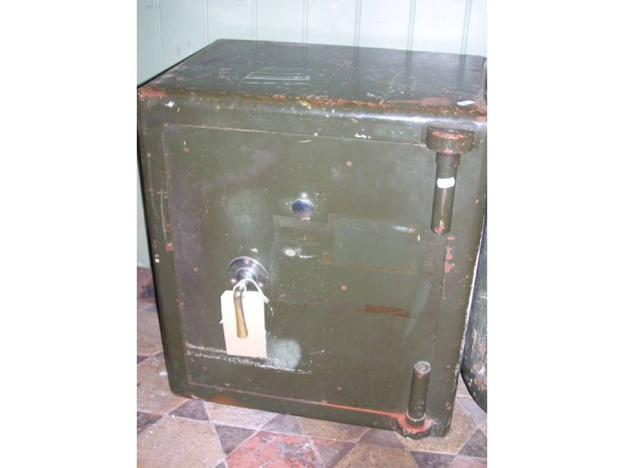 Appraisal: A vintage green painted steel safe enclosed by a single