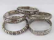 Appraisal: Five white metal Chinese bangles untested wt g