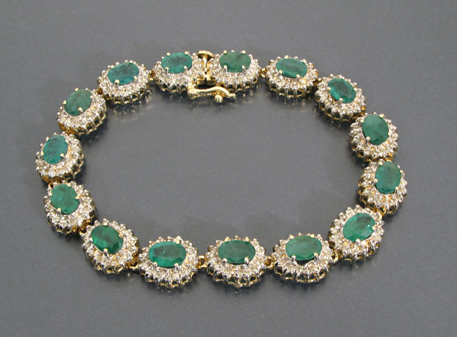 Appraisal: EMERALD DIAMOND AND FOURTEEN KARAT GOLD BRACELET featuring oval links