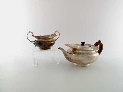 Appraisal: An Edwardian teapot and matching sugar bowl squat circular with