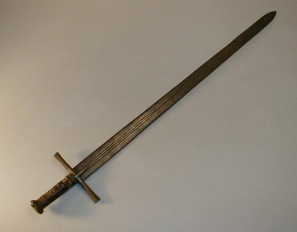 Appraisal: A medieval design sword with a board tapering blade with