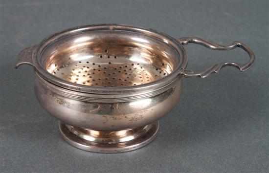 Appraisal: English sterling silver tea strainer and stand with hallmarks of