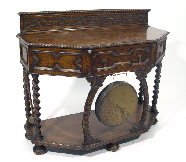 Appraisal: 's oak dinner gong side table with moulded back above