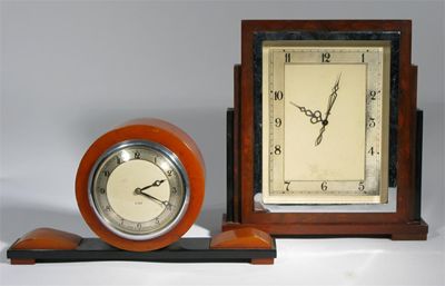 Appraisal: An Art Deco bakelite mantle clock Odeon form amber bakelite