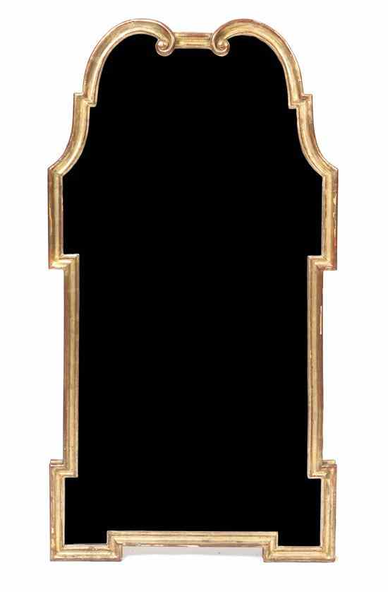 Appraisal: A Continental Giltwood Mirror having a carved parcel gilt frame