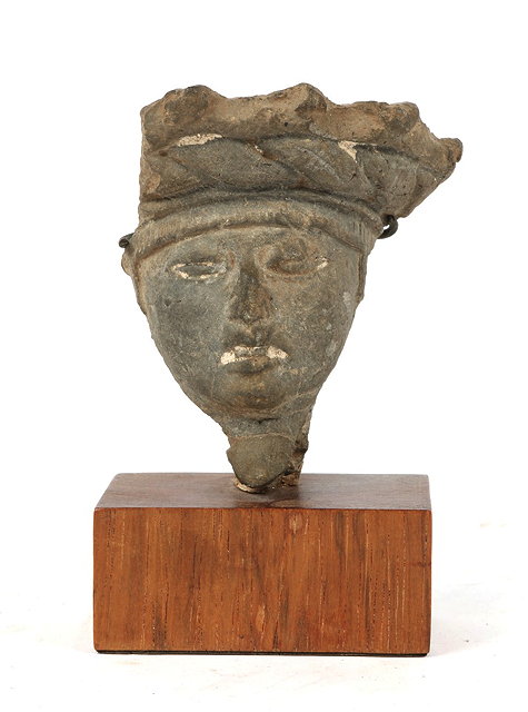 Appraisal: AN ANCIENT CLAY FRAGMENT in the form of a male