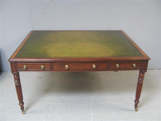 Appraisal: th century mahogany library table six drawers raised on turned