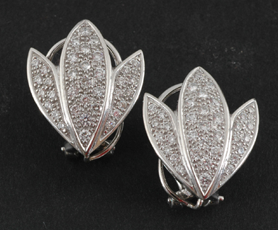 Appraisal: A pair of pave set diamond earrings Modelled as a