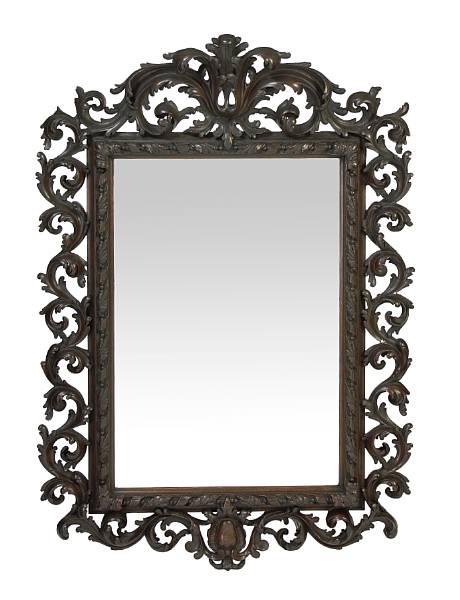 Appraisal: An Italian Rococo style walnut mirror early th century The