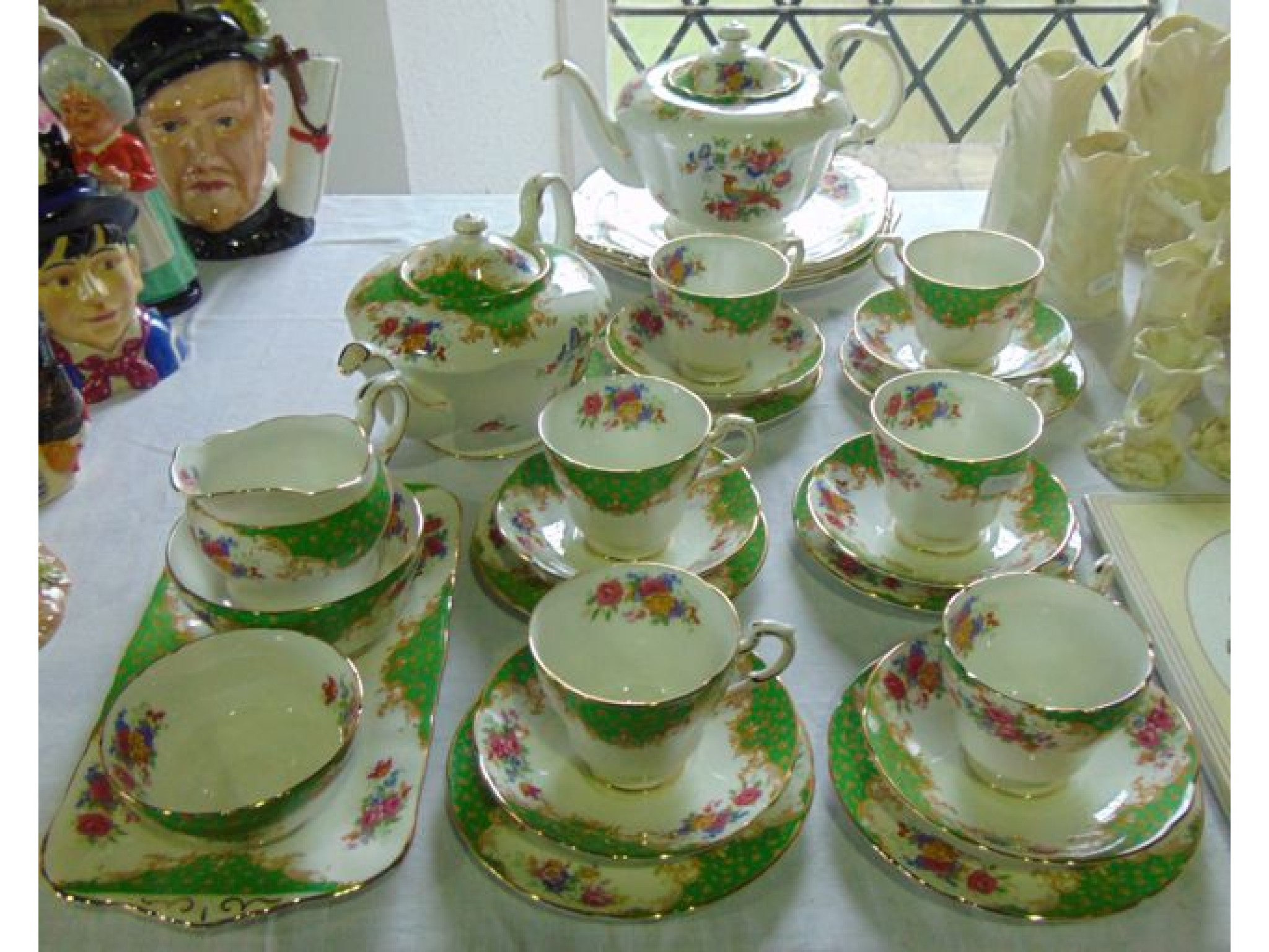 Appraisal: A collection of Paragon Rockingham pattern tea wares comprising two