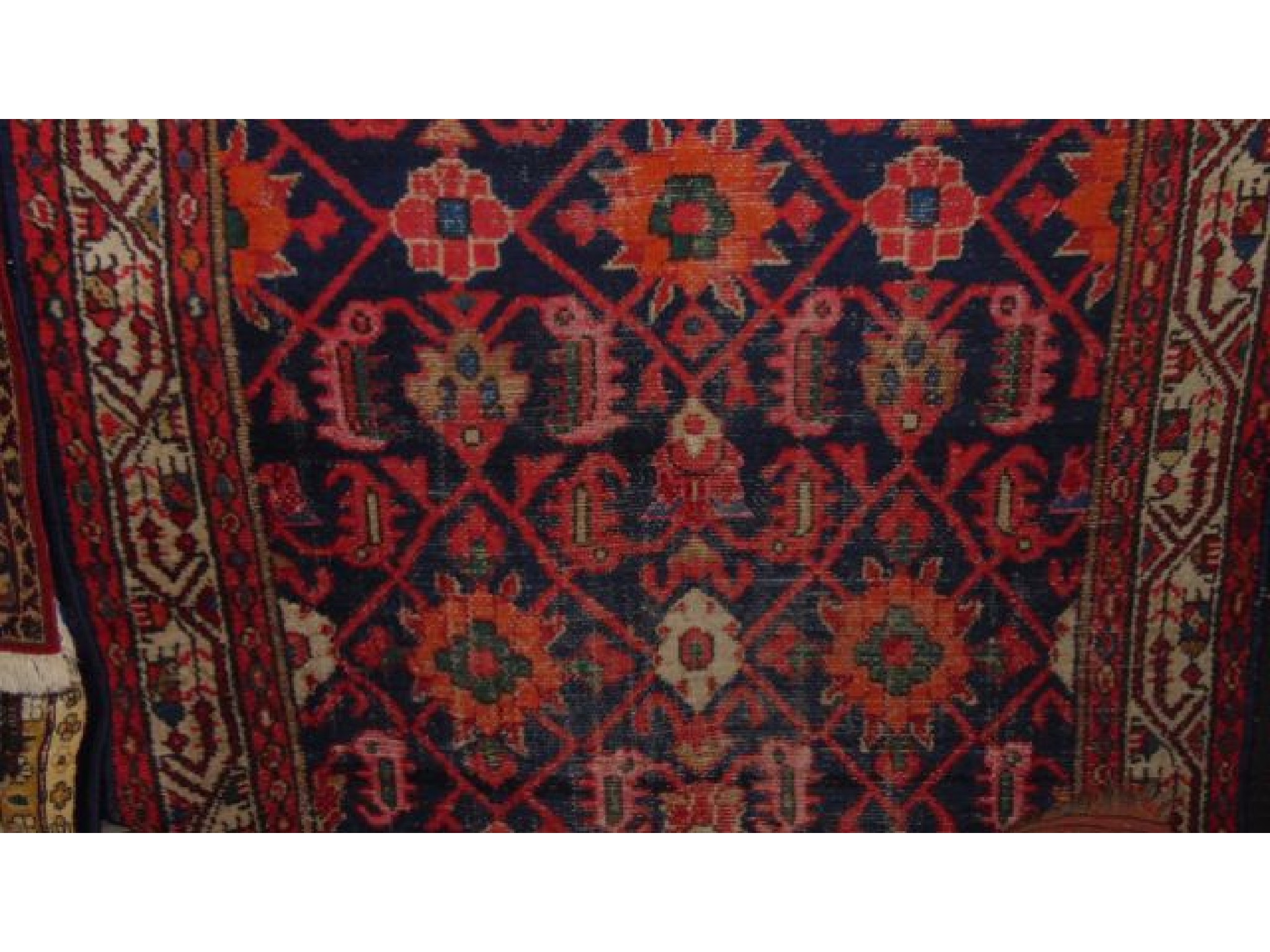 Appraisal: A Persian style wool rug with blue field with geometric