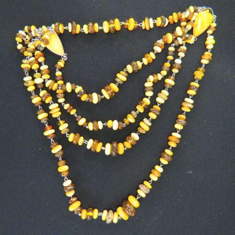 Appraisal: Amber Necklace various colors including honey amber fancy four strand