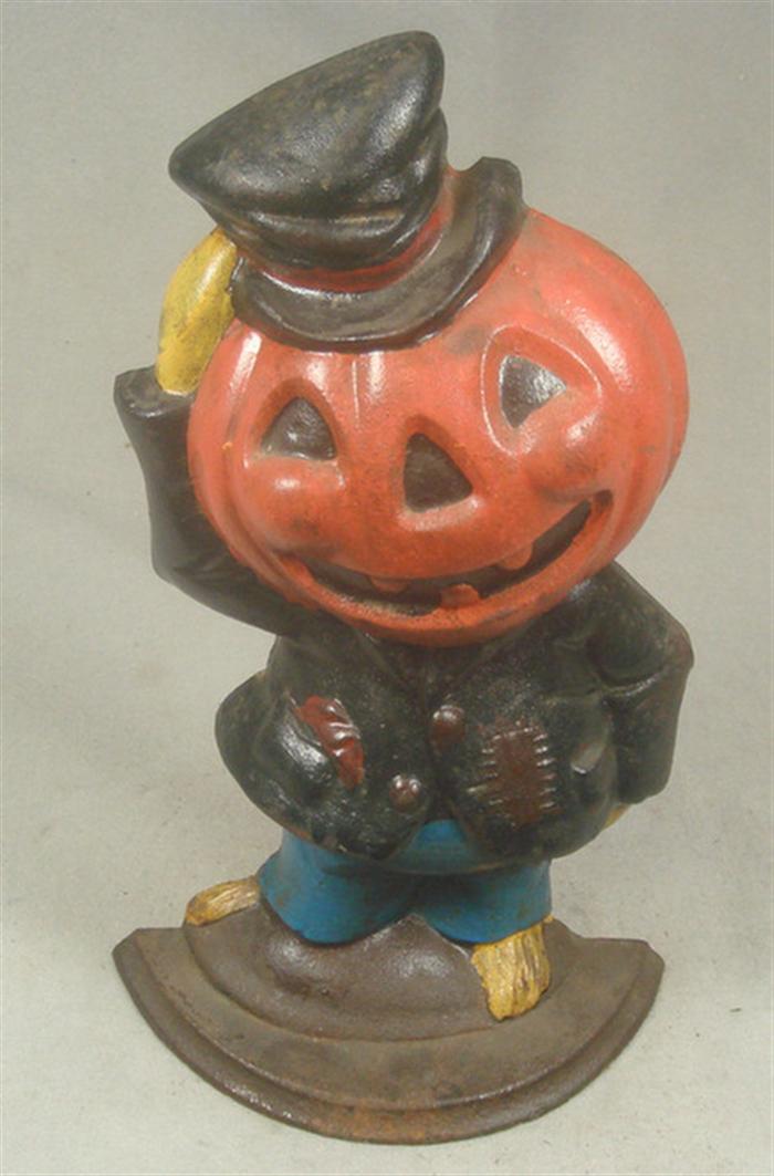 Appraisal: Cast iron doorstop large jackolantern figure with top hat on