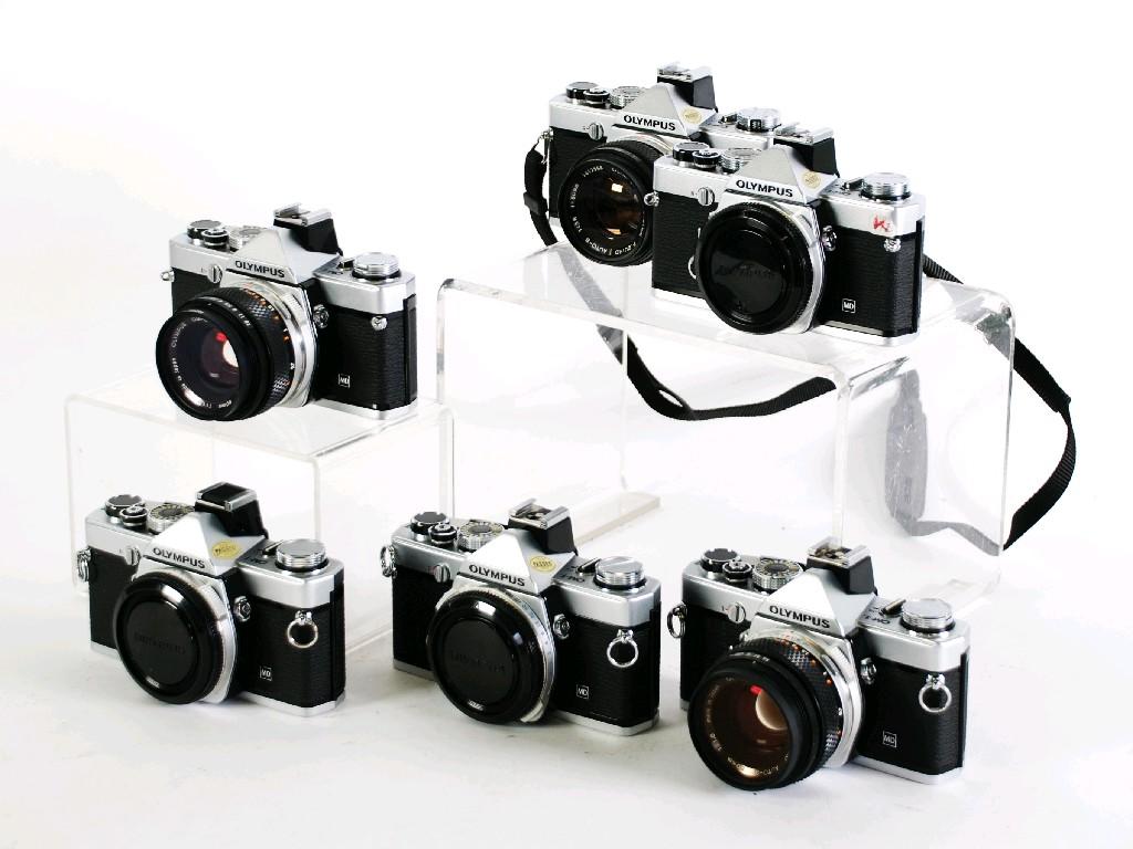 Appraisal: SIX OLYMPUS OM- N mm SLR ROLL FILM CAMERA BOXES