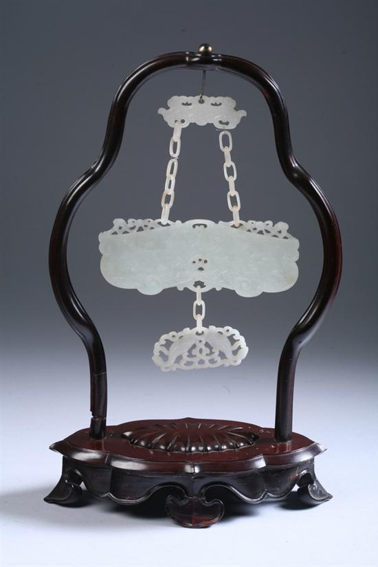 Appraisal: CHINESE CARVED WHITE JADE PLAQUES AND STAND Depicting riverscape and