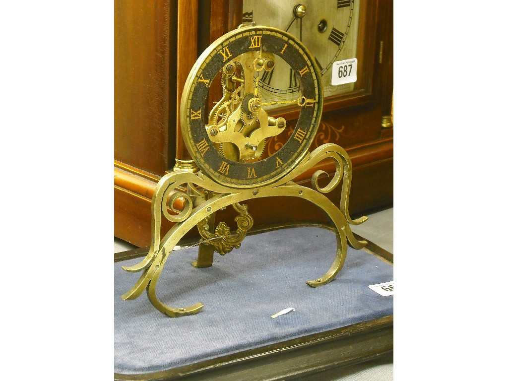 Appraisal: Small French single train brass skeleton clock the black chapter