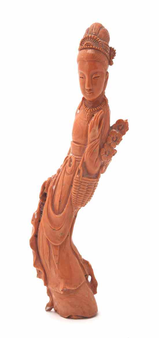 Appraisal: A Coral Carving of a Woman of deep orange colored