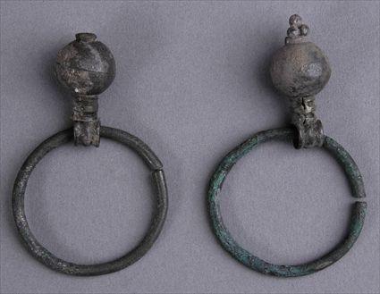 Appraisal: PAIR OF EARLY PERSIAN BRONZE AND SILVER EARRINGS in Provenance