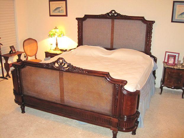 Appraisal: KING SIZE CARVED CANED MAHOGANY BED French style carved with