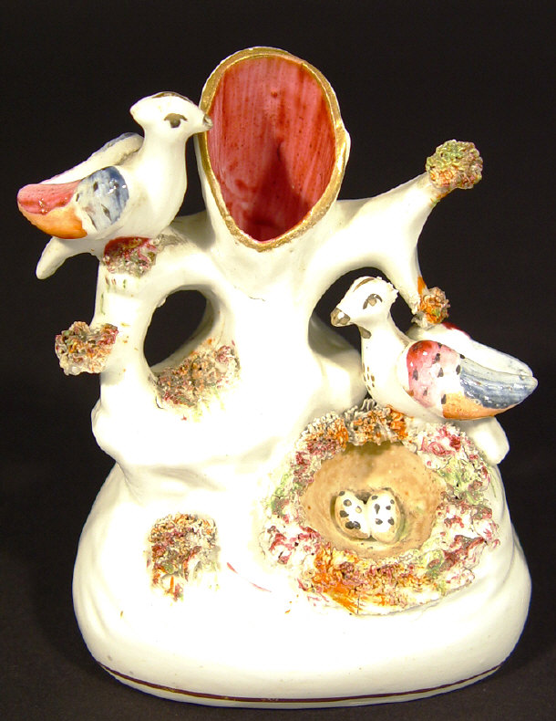 Appraisal: Victorian Staffordshire birds nest spill vase with hand painted decoration