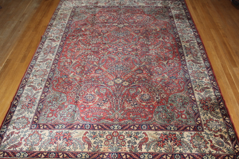 Appraisal: A Persian style bordered carpet and a small modern rug