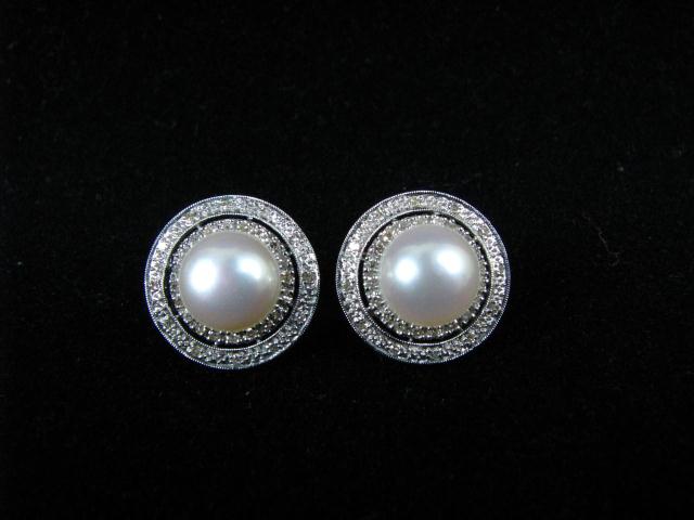 Appraisal: Pair of K white gold earrings with - mm button