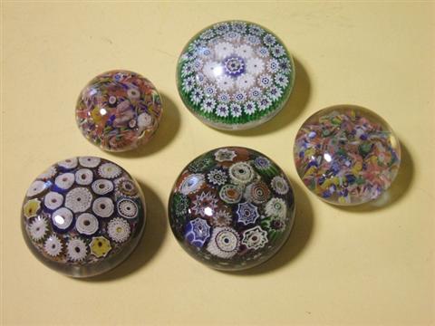 Appraisal: FIVE VARIOUS PAPERWEIGHTS Including two concentric millefiori one close millefiori